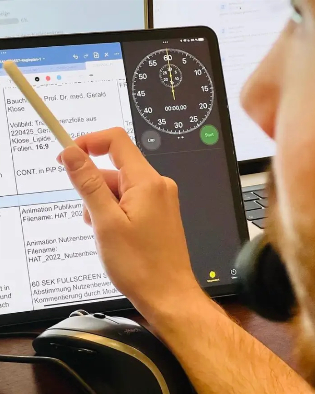 People at a concert facing the stage with various colours of paint powder in the air